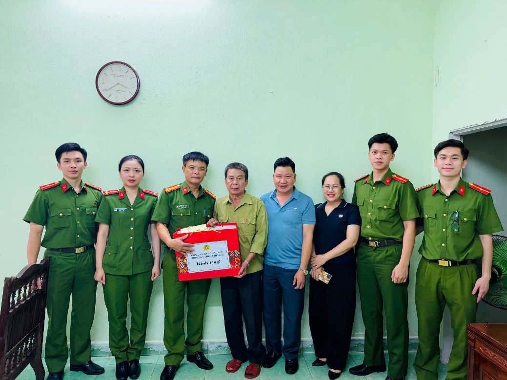The image depicts a group of people, some dressed in military uniforms, standing in a room with a decorated wall, a clock, and a table with some wooden furniture.

AI-generated content may be incorrect.